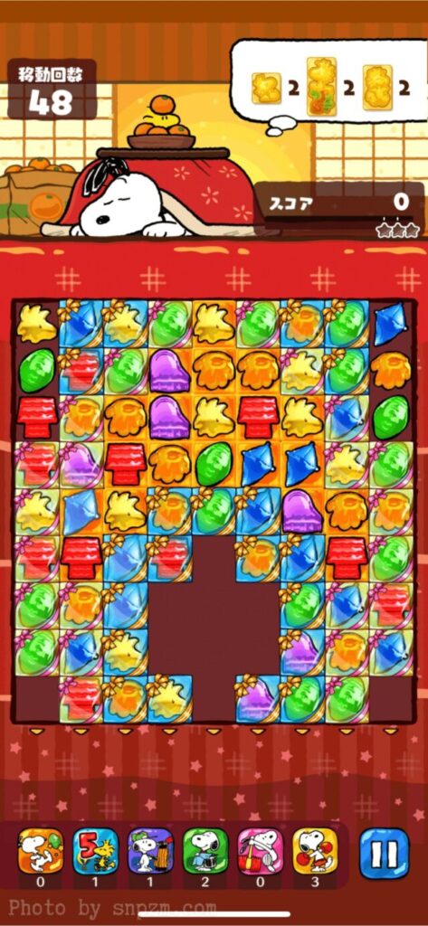 スヌーピーライフのスクリーンショット。みかんのあるこたつで寝るスヌーピーのパートナー